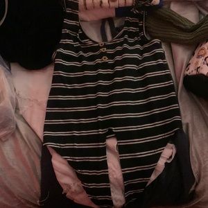 Black with white stripes and buttons, ties in the front.